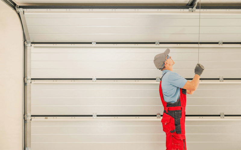 Worker-in-Fort-Worth-fixing-garage-door